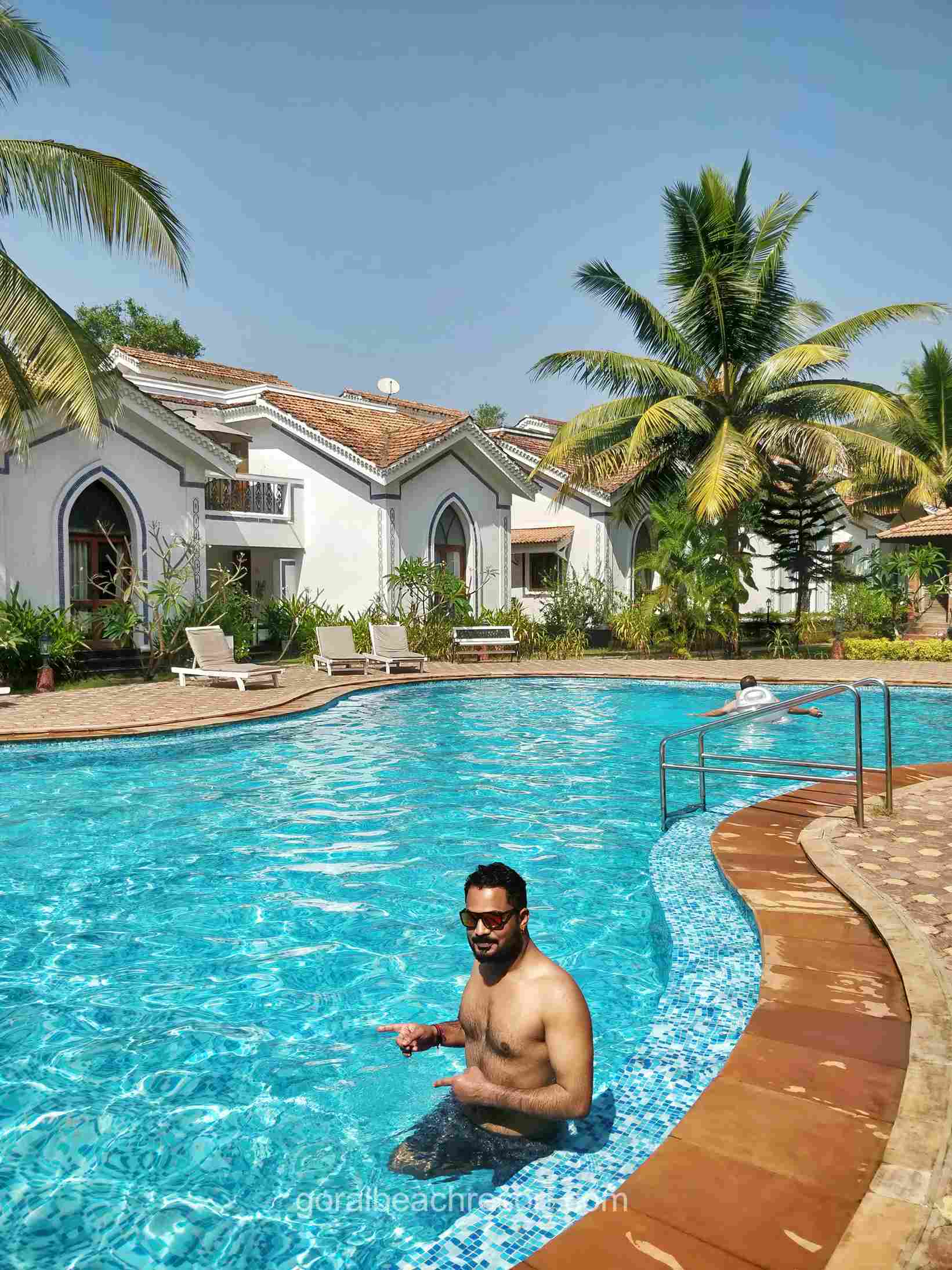 beach resort with man in pool_2_11zon